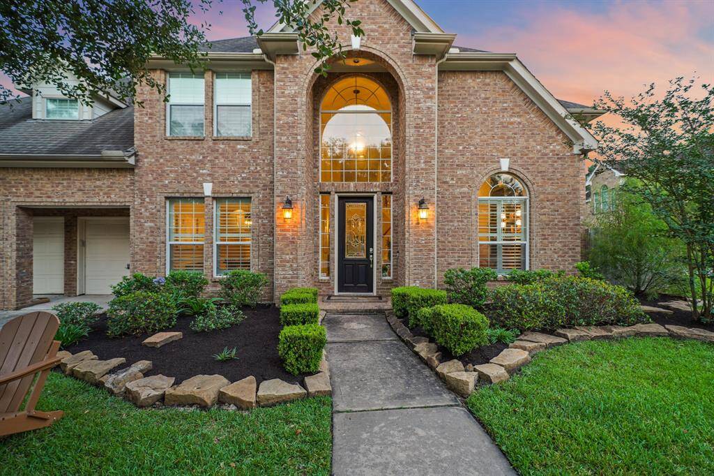 Mature landscaping and amazing curb appeal at this Spring Trails home