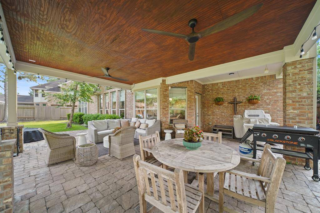 Wood ceiling on the covered Patio and two ceiling fans