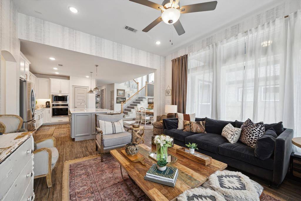 Bright and airy yet warm and inviting, this living room offers plenty of space and stunning views through expansive windows