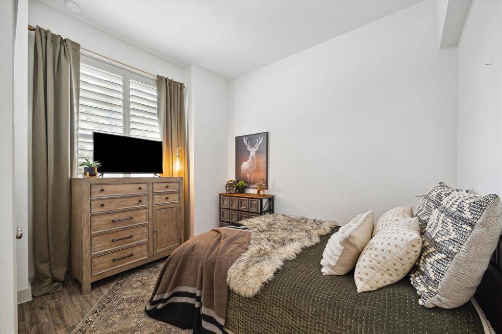 Welcome guests in style with a spacious first-floor guest room, offering comfort and convenience with easy access and a warm, inviting atmosphere.