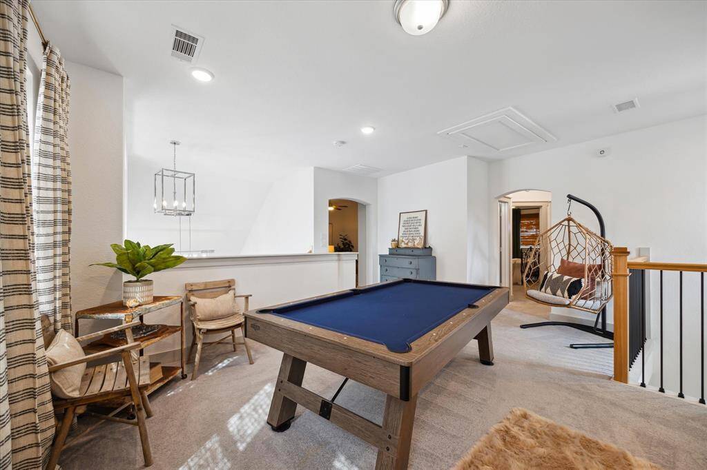 Turn this generous loft space into a pool hall, playroom, or cozy second living area.