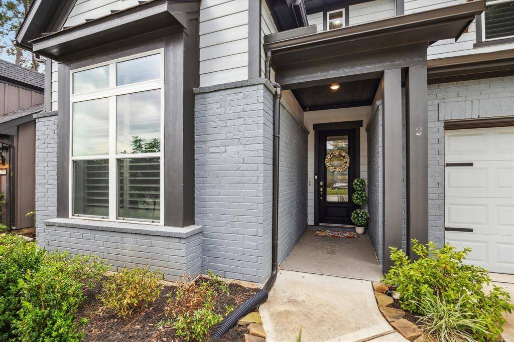 Stunning view of the property's inviting entrance. With excellence in the construction and design elements in every part of the home, this residence exudes top-shelf quality.
