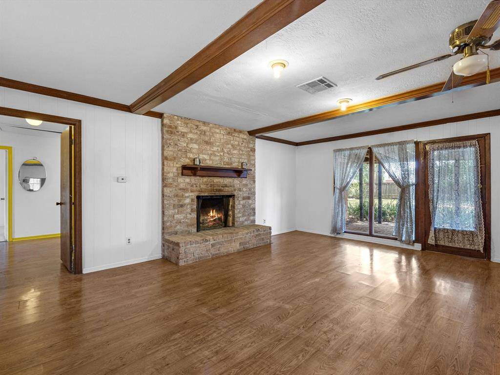 Family room with cozy wood burning fireplace.
