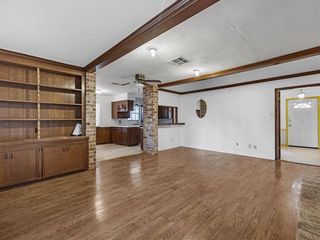 Family living room with beautiful ceiling beams.
