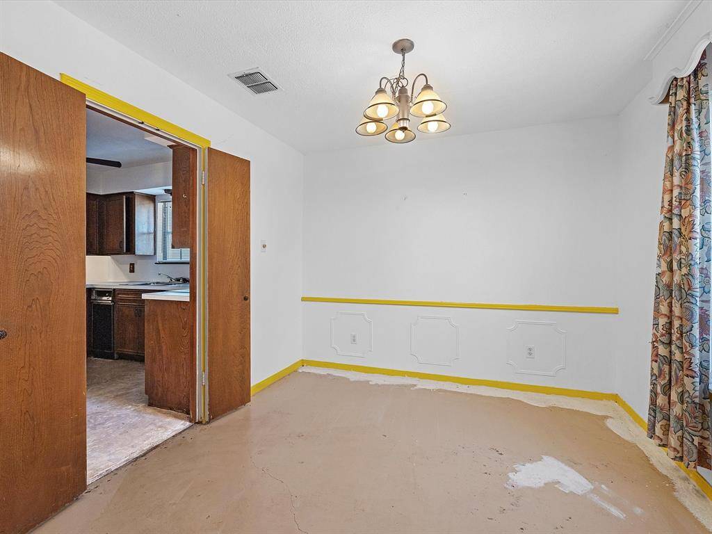 Formal dining room just off of kitchen.