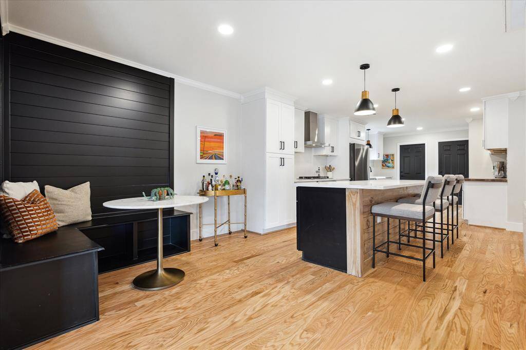 This cozy corner breakfast nook, complete with built-in seating, is the perfect spot for intimate meals with family and friends while adding extra seating and a designer touch to the space.