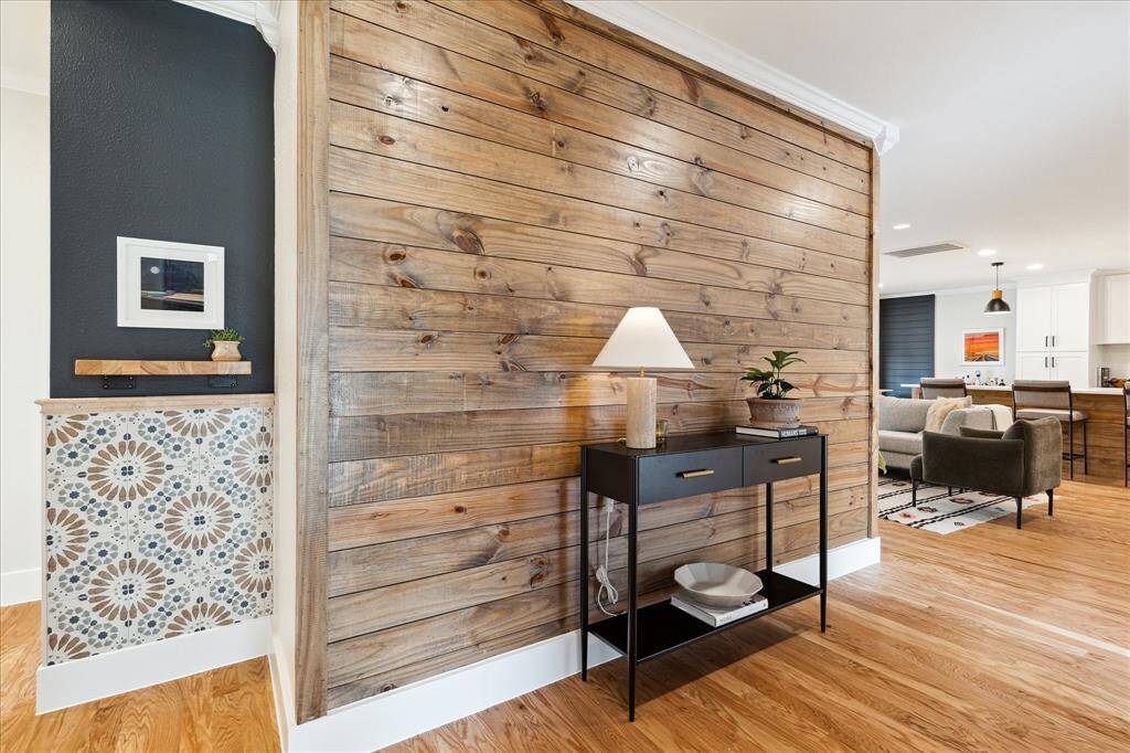 This home is full of cool designer accents that add personality and charm throughout! From the entryway, the hallway leads you toward the primary suite and an additional secondary bedroom and full bath.