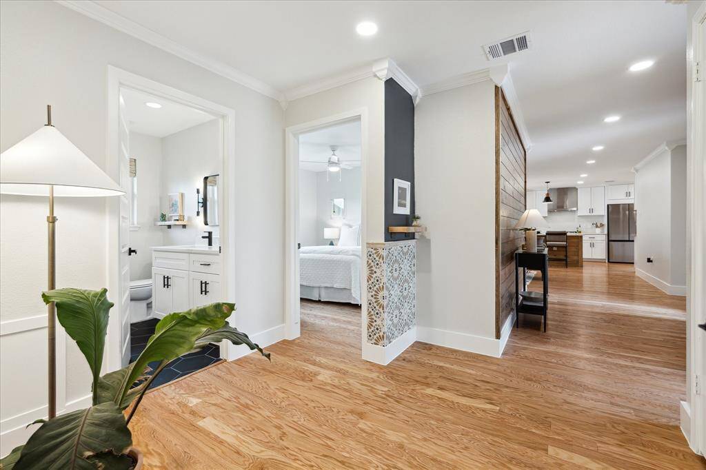 A well-sized hallway offers a welcoming transition from the living areas plus a coat closet on the right.