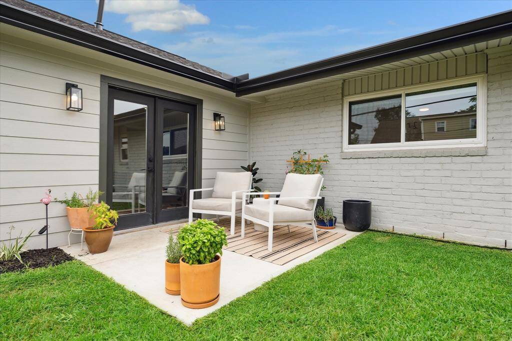 Outdoor Living: Just off the dining area, a welcoming patio invites you to relax or entertain. A spacious backyard! Note: all exterior doors have been replaced except for the restored double front doors.