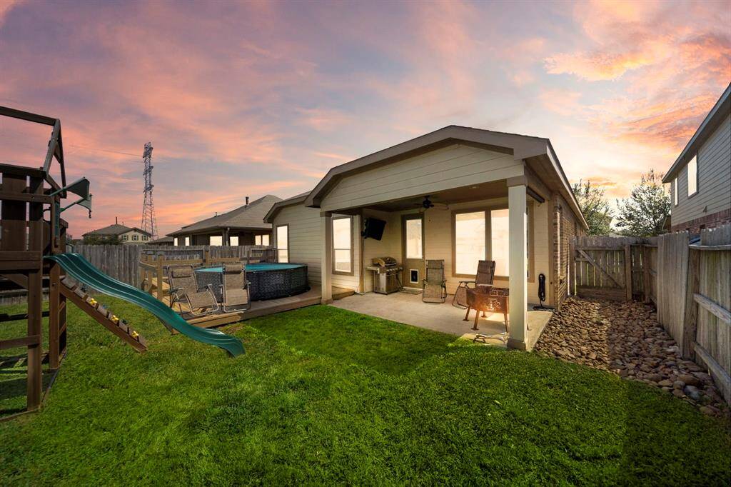 Personal retreat with this inviting backyard, featuring a spacious covered patio, deck with a Pool, and plenty of lawn space for family fun. Ideal for relaxation and entertaining.