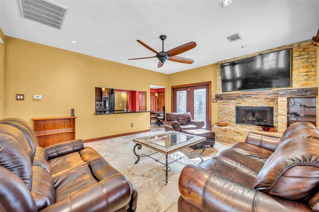 Spacious living room with built in fireplace and tv nook.