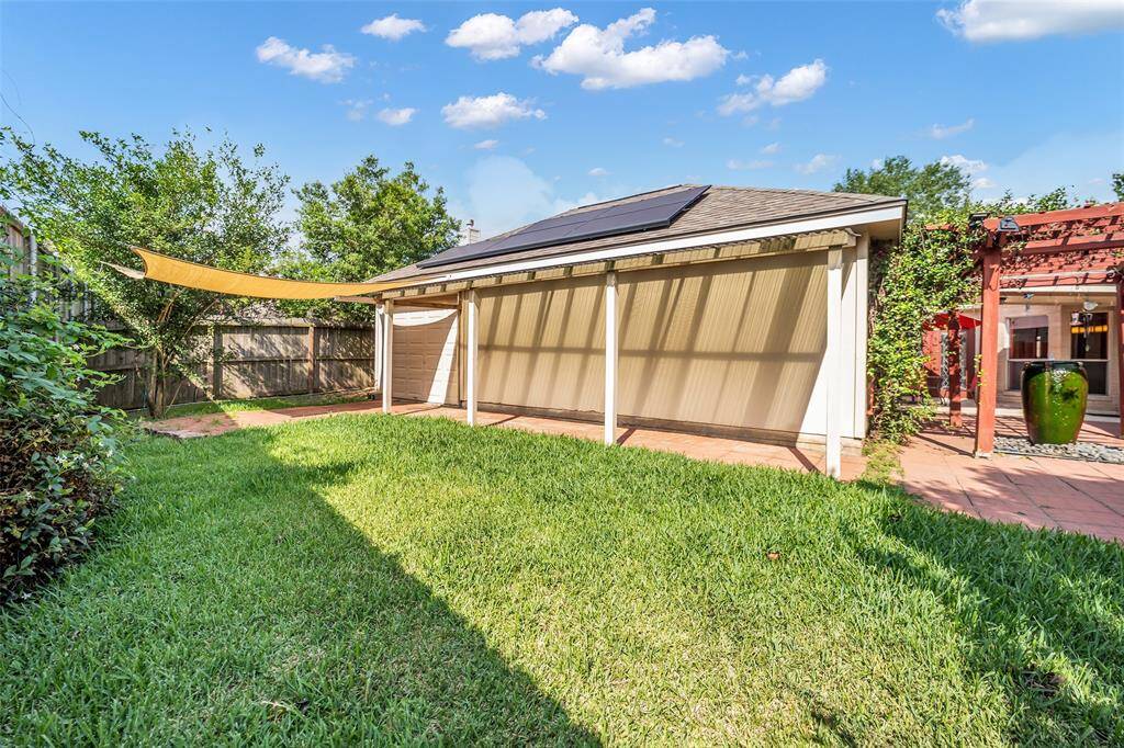 3 car garage with back yard access via another roll up garage door option.