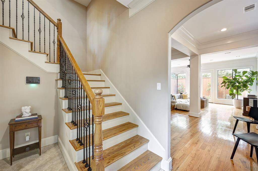 As you enter, you have the stairs to the left and sun-drenched living/dining straight ahead