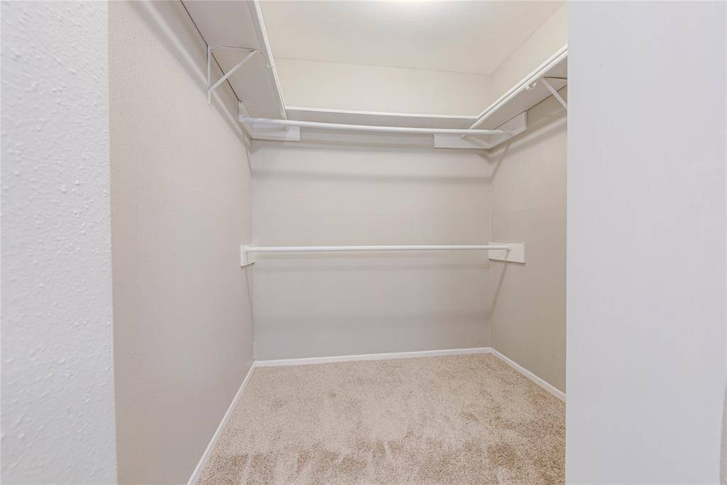 Enjoy a spacious walk-in closet in the primary bedroom, offering ample storage for clothes, shoes, and accessories.