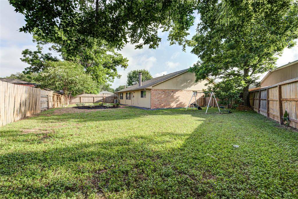 tep outside to a beautifully landscaped backyard with mature trees, plenty of green space, and a patio area for grilling or relaxing outdoors.