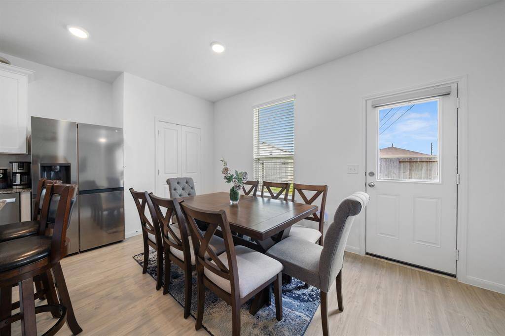 The cozy breakfast nook is open to the living area, creating a seamless flow for casual dining and conversation.