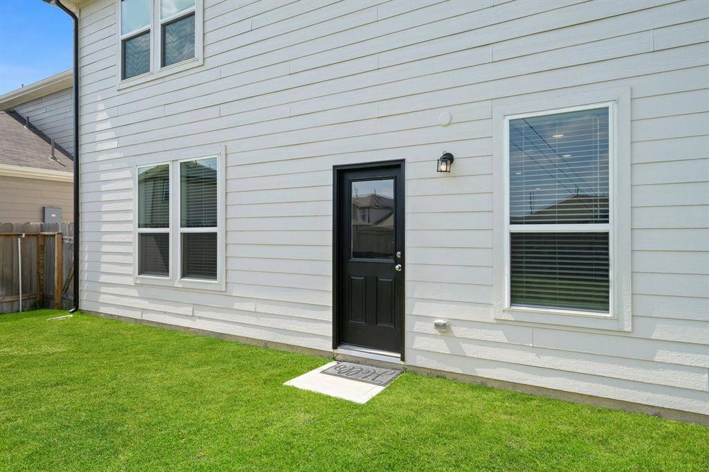 Fully fenced backyard offers privacy and security. Enjoy this serene spot in your new home!