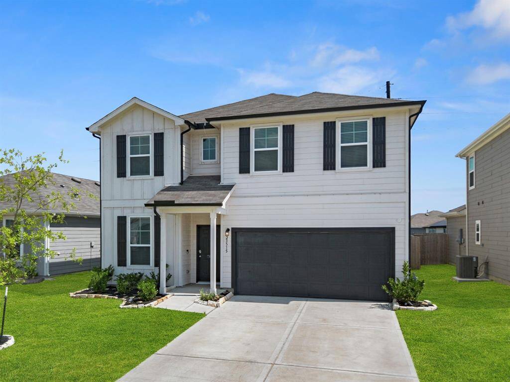 The 2-car garage provides ample parking space along with built-in storage for added organization.