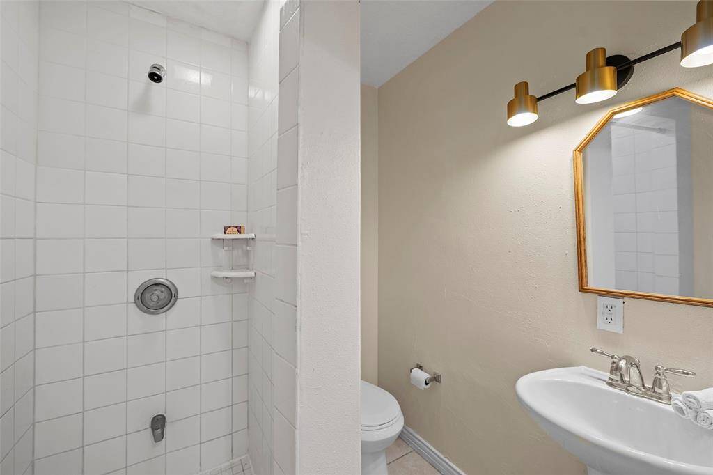 Full bath with stand up shower off main living space and flex.