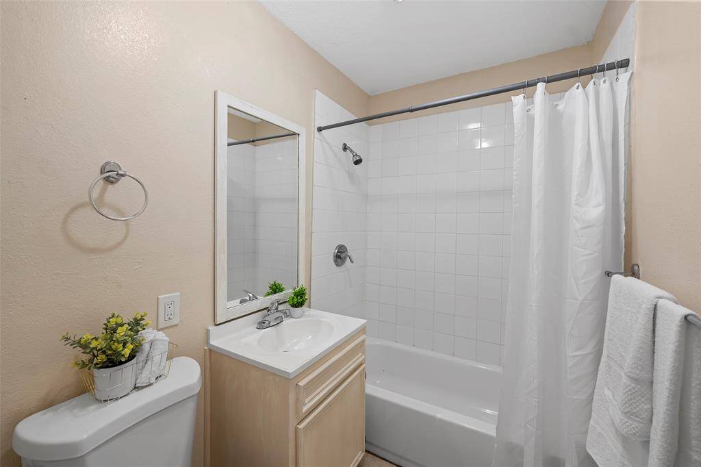Bathroom 2 with tub and shower combo.