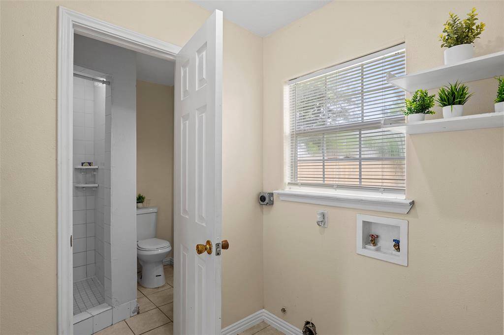 Laundry room leads into full bath.