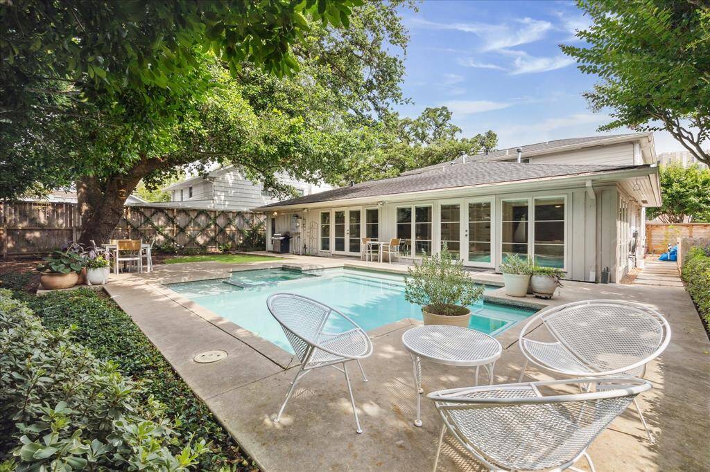 Tucked beneath the canopy of a majestic oak tree, the lushly landscaped backyard is your personal paradise—complete with a sparkling heated pool, spa, and a dedicated pool bath.