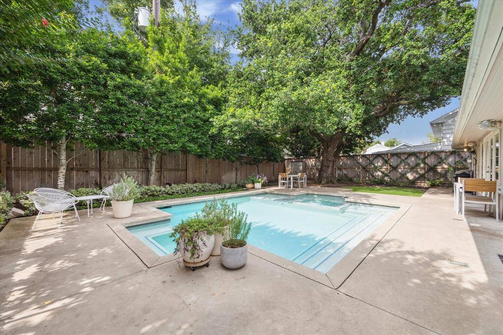 Mature trees allow privacy for this backyard.