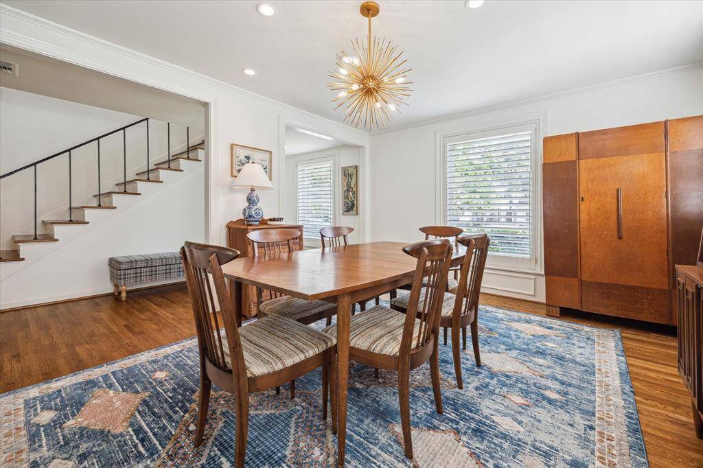Located at the front of the house, the dining room, enjoys two wall of windows.