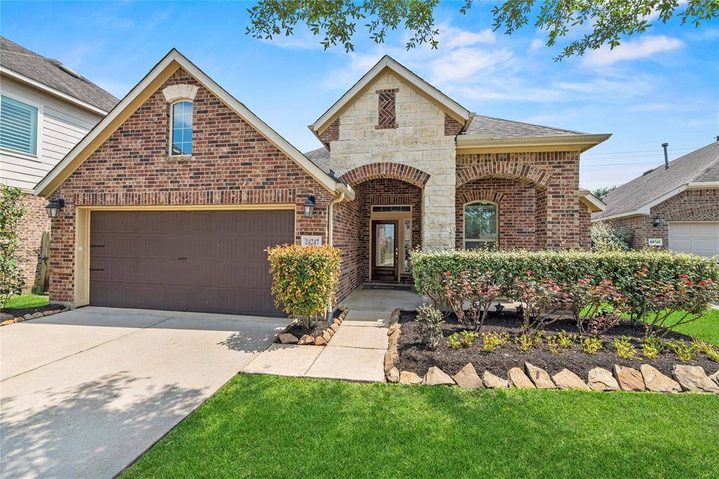 Welcome home to 24747 Ballad Drive, nestled in the charming King Crossing community! This stunning residence offers an exceptional blend of elegance, comfort, and modern charm.