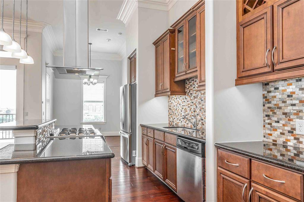 Condo Offers Stainless Steel Appliances, Granite Countertops & Custom Cabinetry Throughout