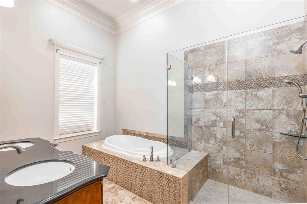 Ensuite Primary Offers Double Sinks, Deep Soaker Tub & Large Walk In Shower