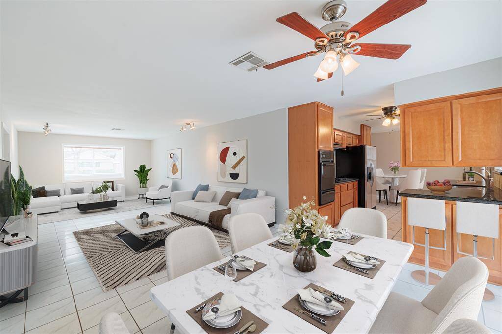 Virtually staged - Dining, living and seating area.
