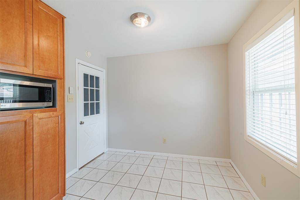 Breakfast nook area in kitchen that leads to the garage.