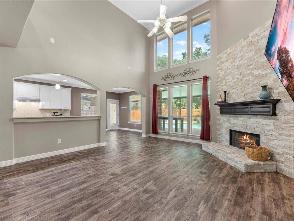 The kitchen is open to the family room with high ceilings and laminate floors throughout the 1st floor