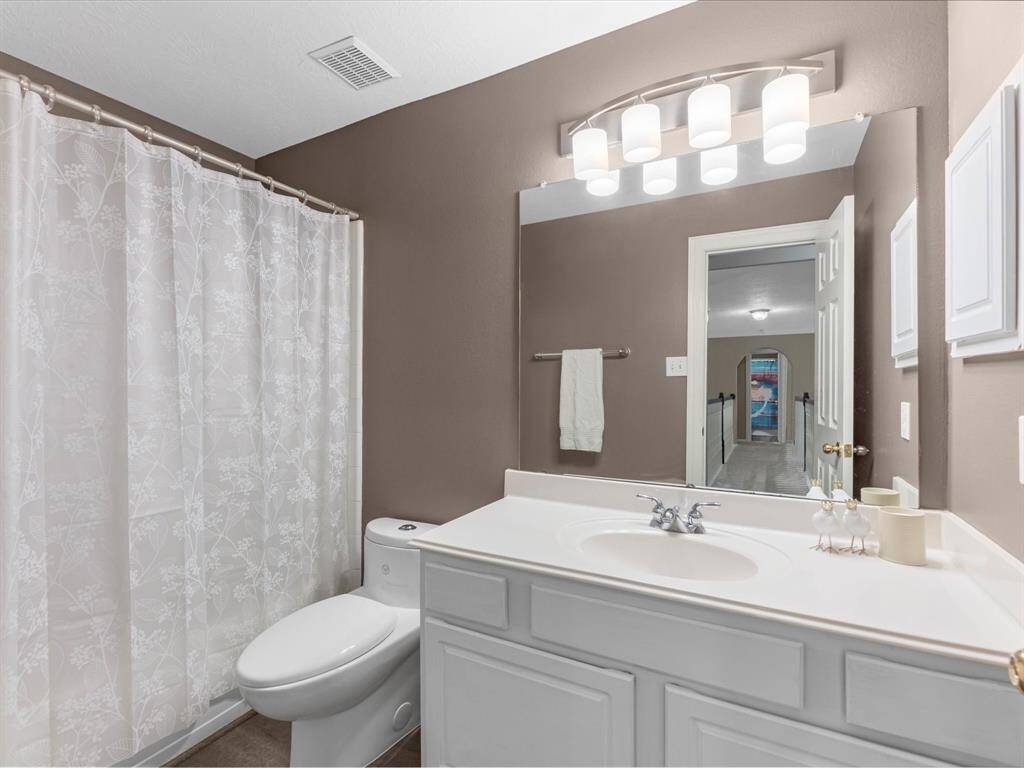This full bathroom is next to a secondary bedroom near the gameroom
