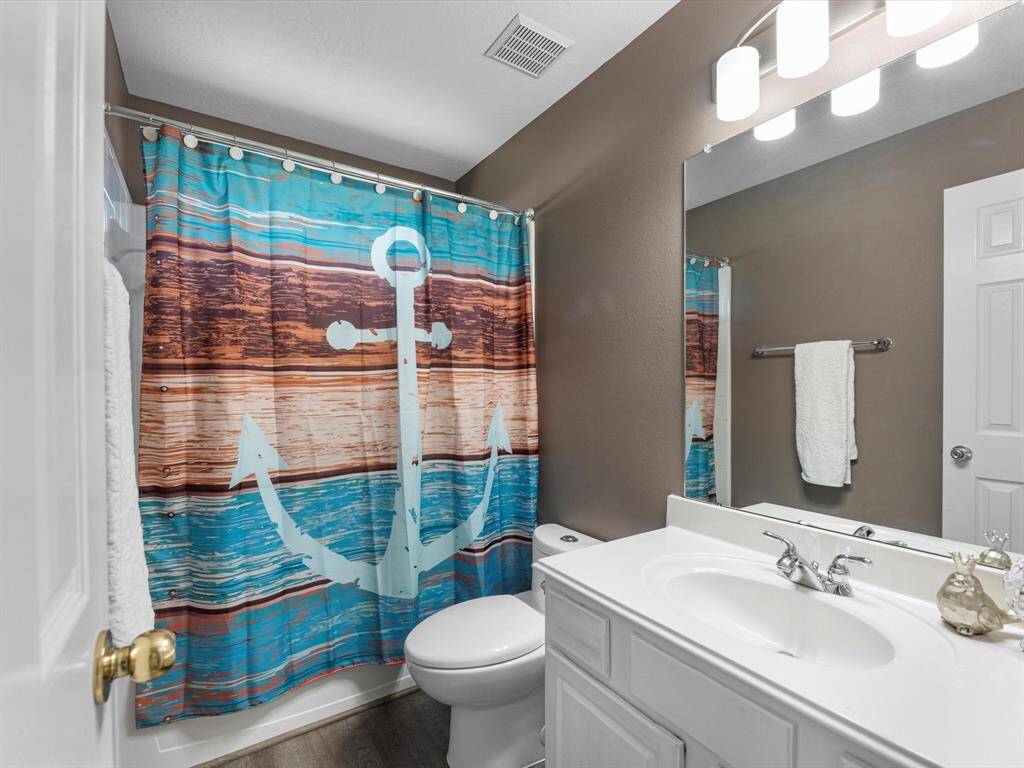 This full bath is the 3rd full bath in the home and is between 2 secondary bedrooms