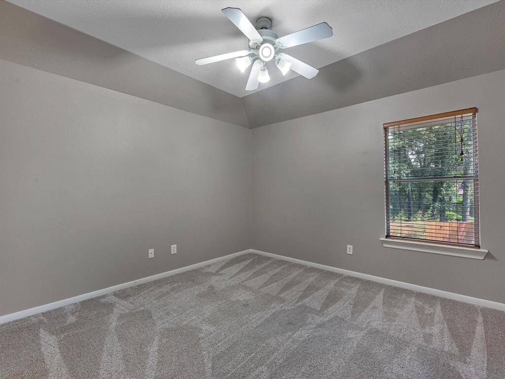 The last secondary bedroom upstairs. These are all nice size rooms with ceiling fans