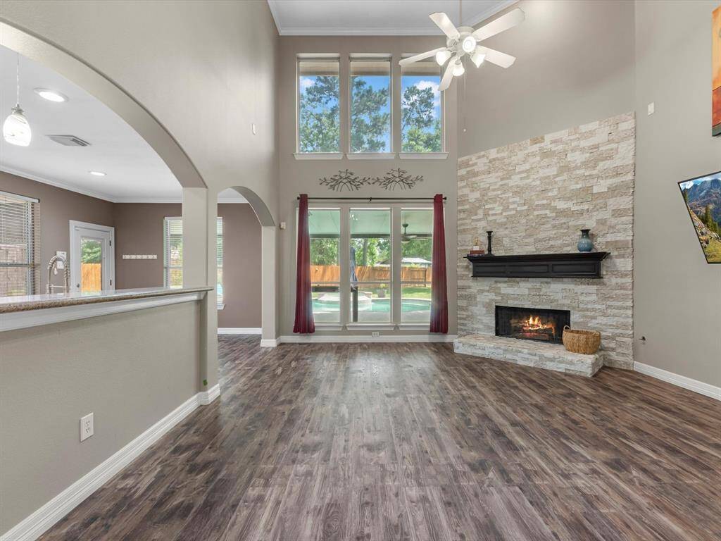 In the family room looking at the terrific view out back towards the pool and yard