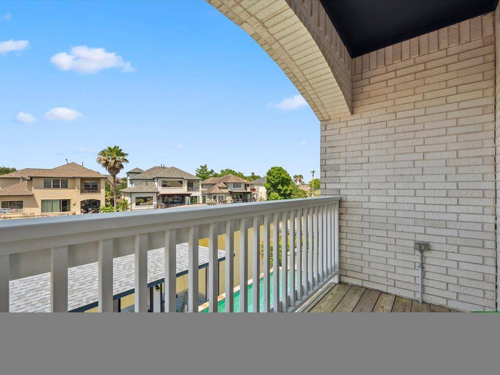 THE PRIVATE BALCONY OFF THE SECOND BEDROOM ALSO FEATURES POOL AND WATER VIEWS.