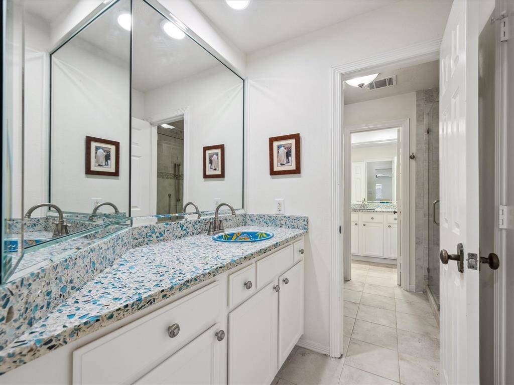 THE FOURTH BEDROOM IS ATTACHED TO A FULL, HOLLYWOOD BATH WITH PRIVATE VANITY.
