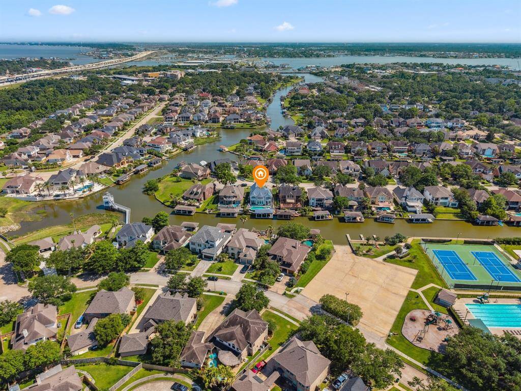 THE AERIAL VIEW SHOWS THE CANAL OPENING TO CLEAR LAKE WHICH OPENS TO GALVESTON BAY.