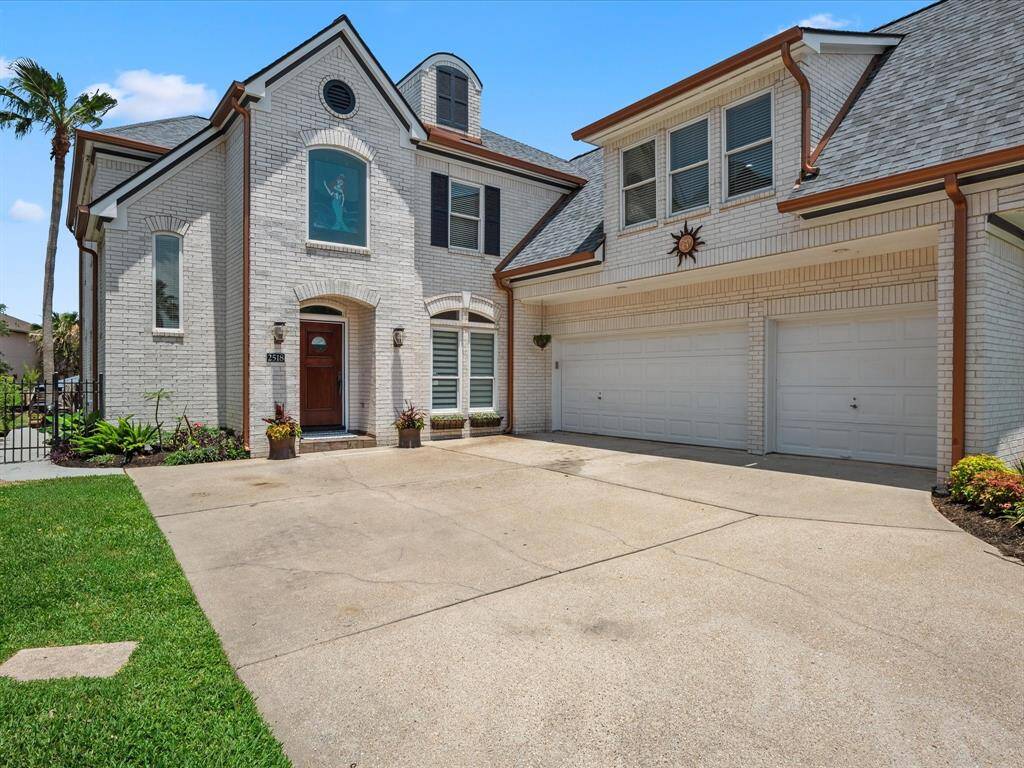 FRONT ELEVATION HIGHLIGHTING THE POPULAR 3 CAR GARAGE.