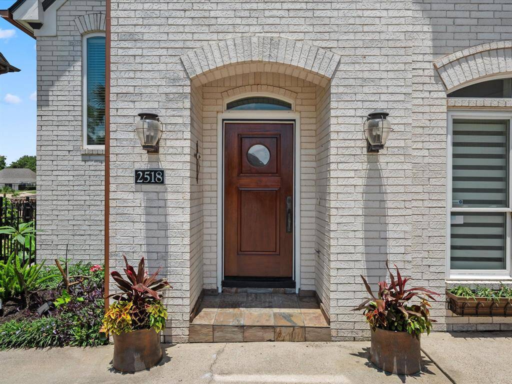 ENTRY WITH SOLID WOOD FRONT DOOR.