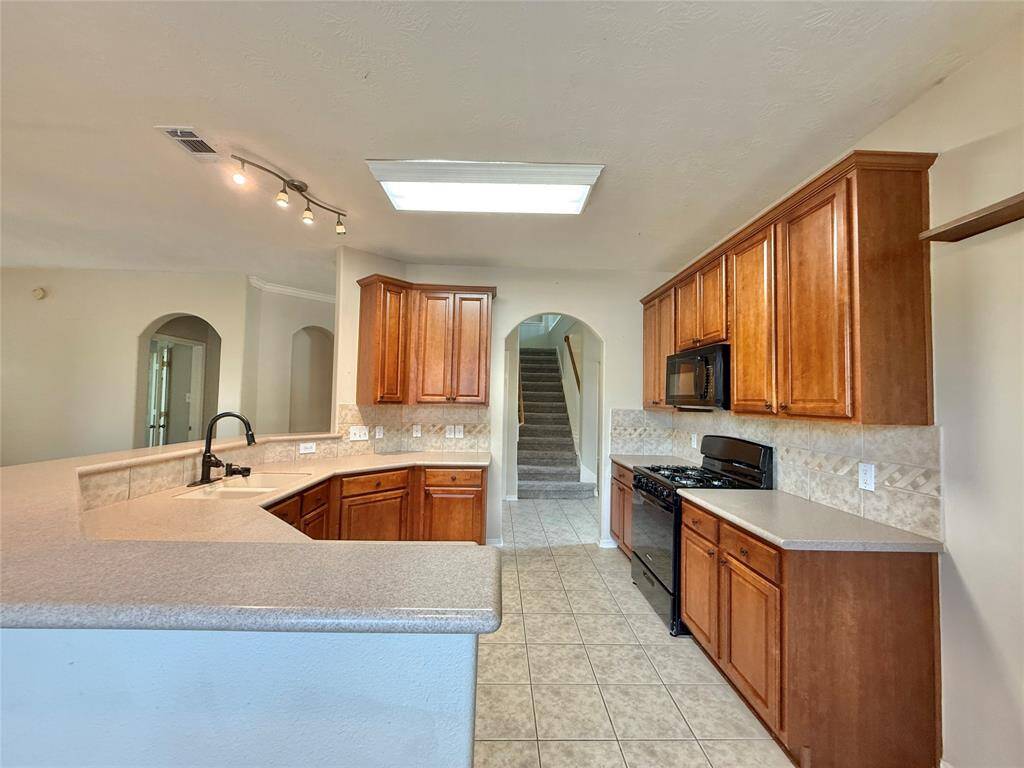 Kitchen overlooks family room