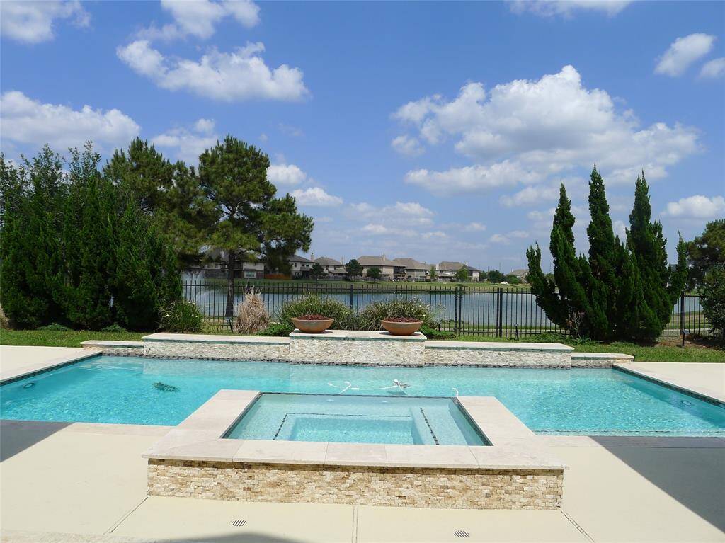 Wow! Wat a breathing taking view of this large two story luxury high quality w lots of custom feature lake front home this inviting pool/spa for you to enjoy Summer.