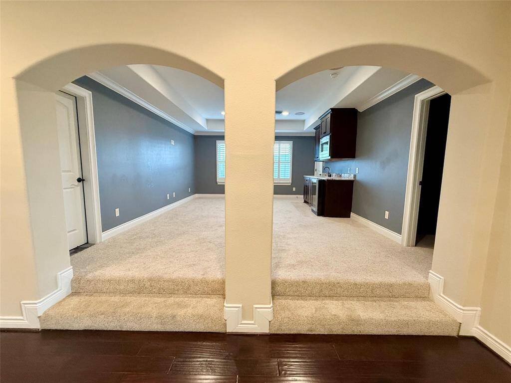 Step up to this huge gameroom with built-in mini bar.