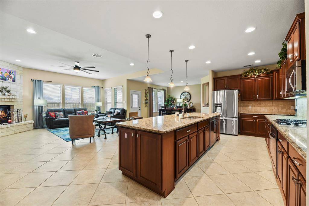 Experience seamless open-concept living where the kitchen, breakfast area, and living room flow effortlessly together. This thoughtfully designed space is perfect for both everyday comfort and entertaining, with natural light pouring in to highlight the stylish finishes and inviting atmosphere.