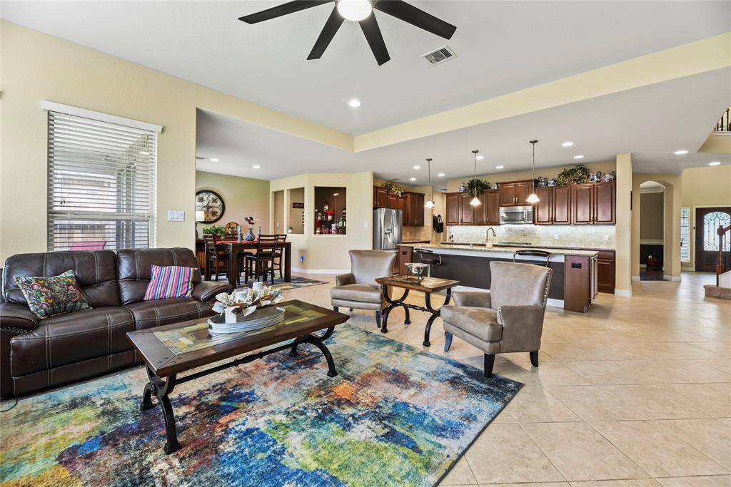 Thoughtfully connected living, kitchen, and breakfast areas create a harmonious environment perfect for both relaxed everyday living and elegant entertaining, all bathed in natural light and finished with refined details.