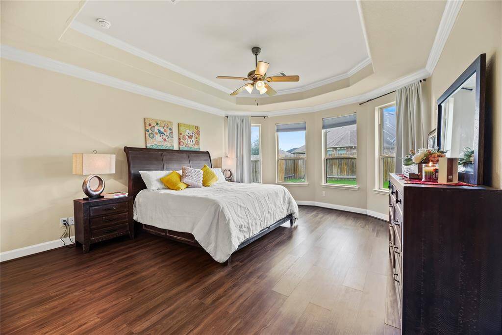 How perfect is this primary suite? Spacious and filled with natural light, this serene retreat offers the ultimate escape, promising comfort, tranquility, and pure relaxation.