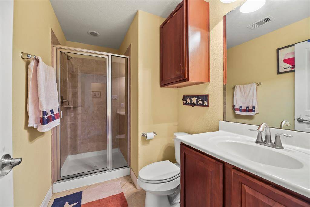 The secondary bathroom is stylishly appointed and thoughtfully designed for comfort and convenience.